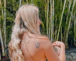 She has a tattoo on her back.